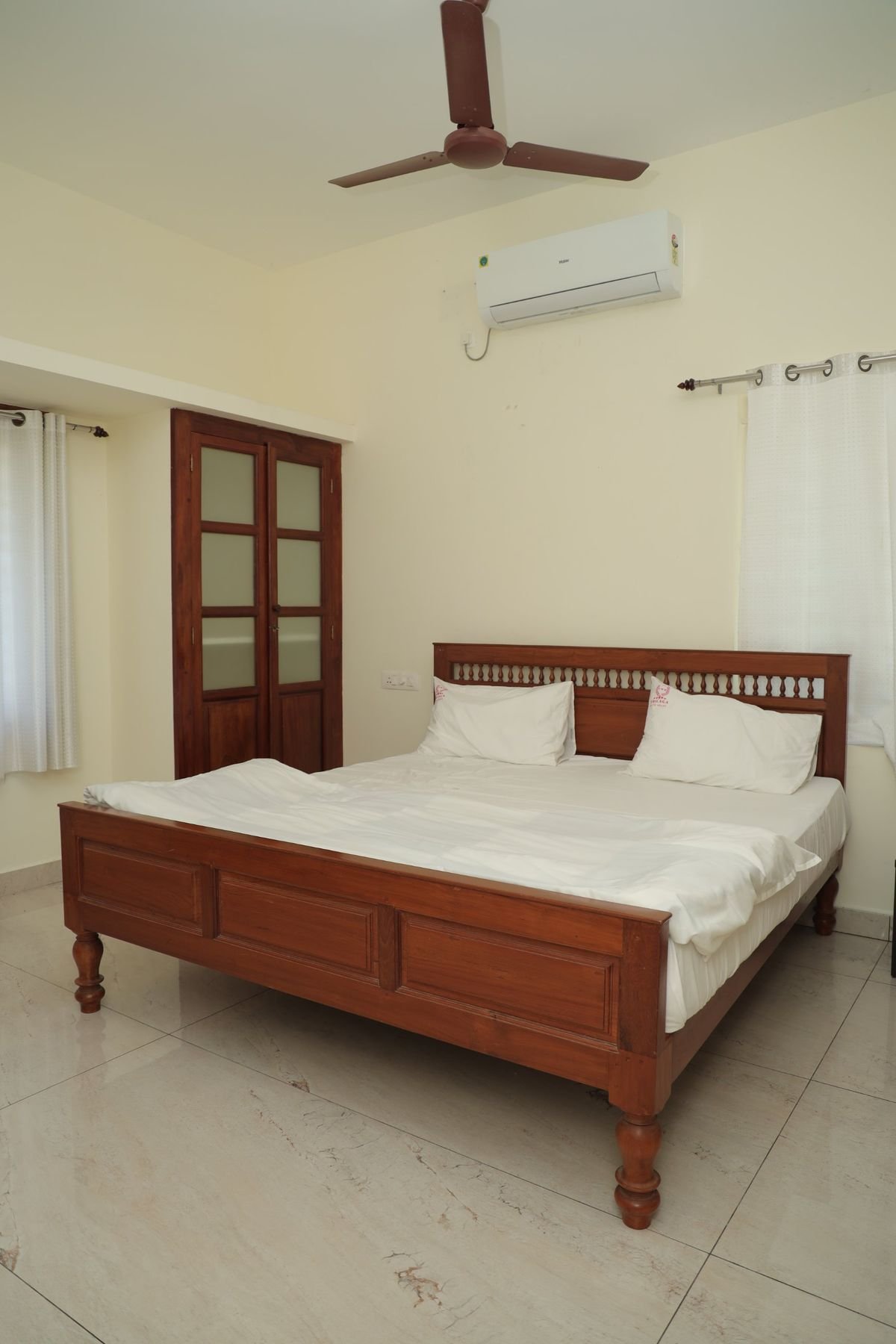 Room with carved teak headboard